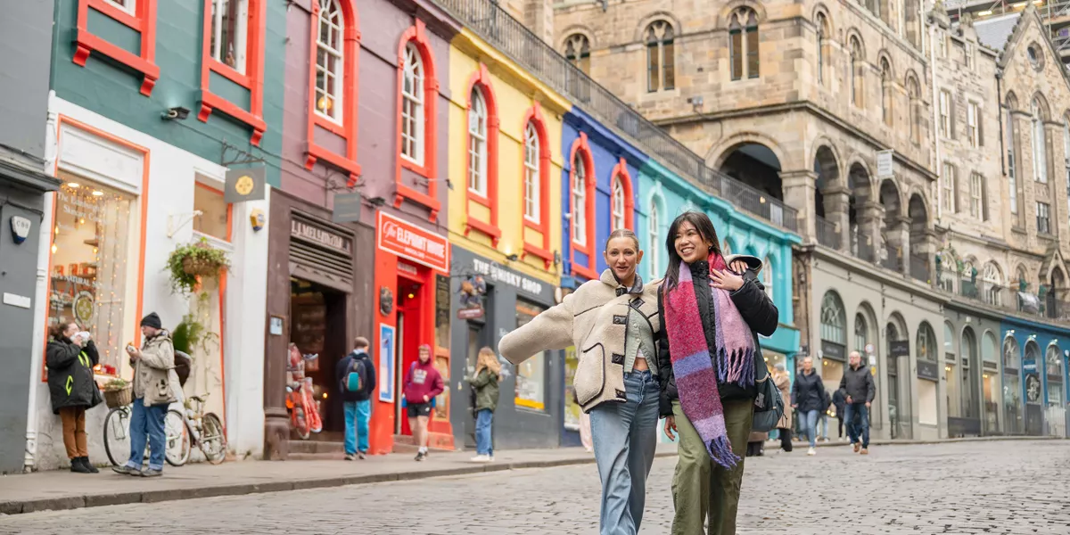 Friends Walking Through Edinburgh Streets