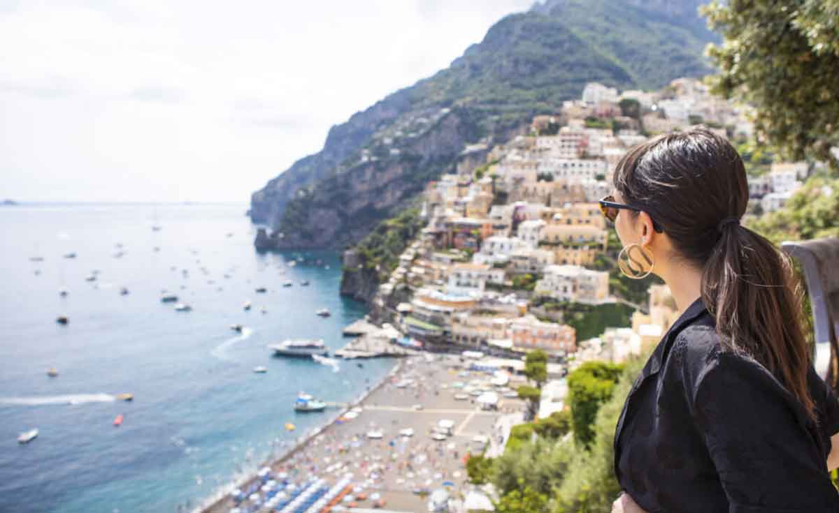 Female Traveler Looking Over The Amalfi Coast