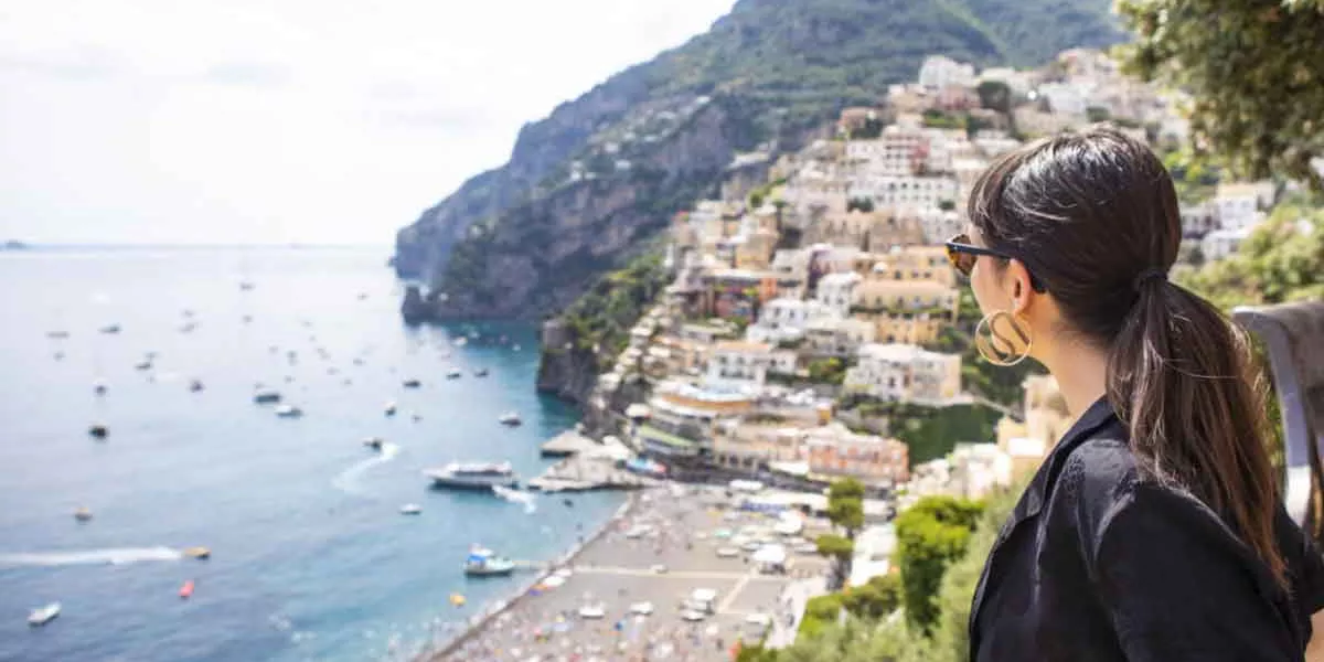 Female Traveler Looking Over The Amalfi Coast
