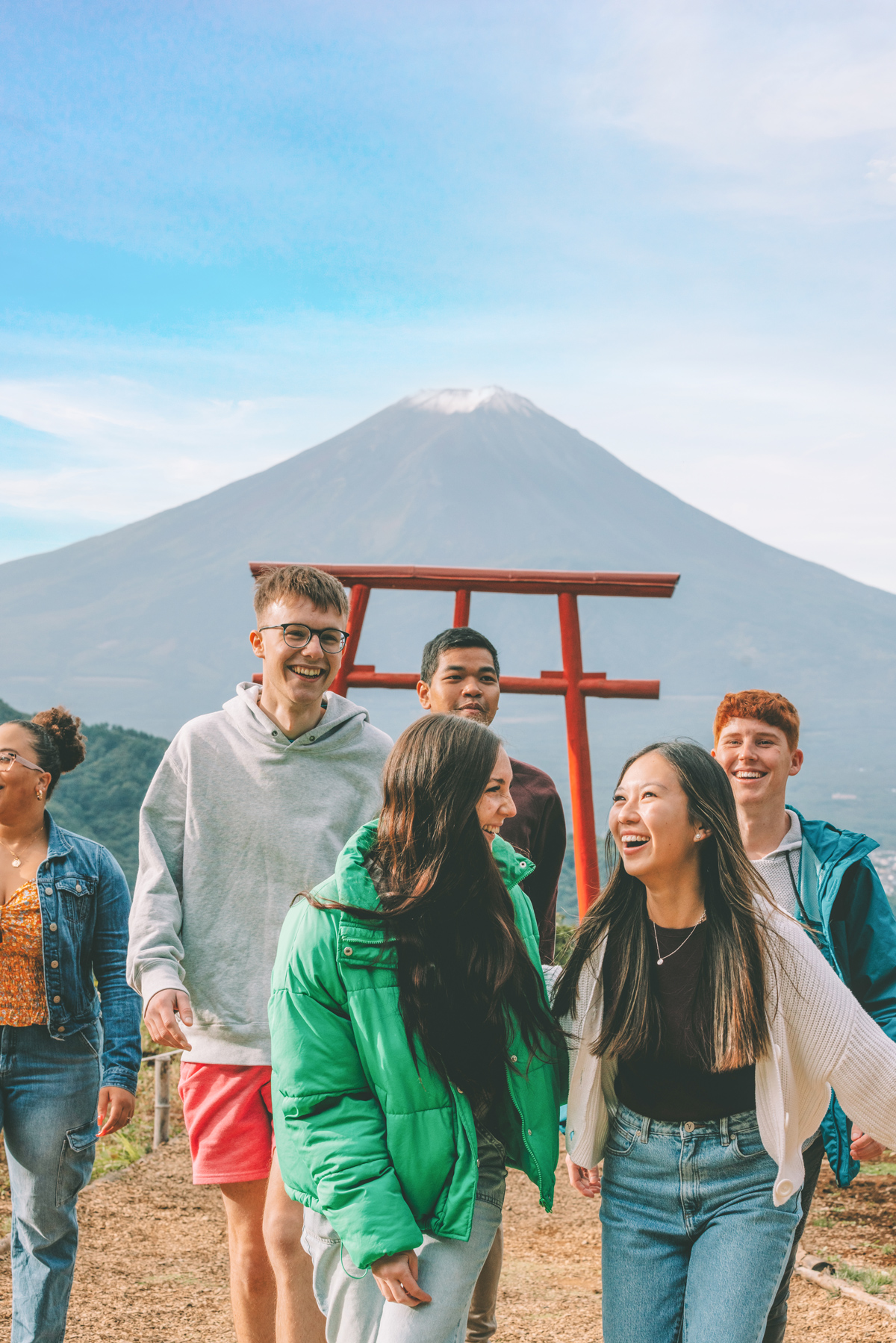Group Laughing In Front Of Mount Fiji