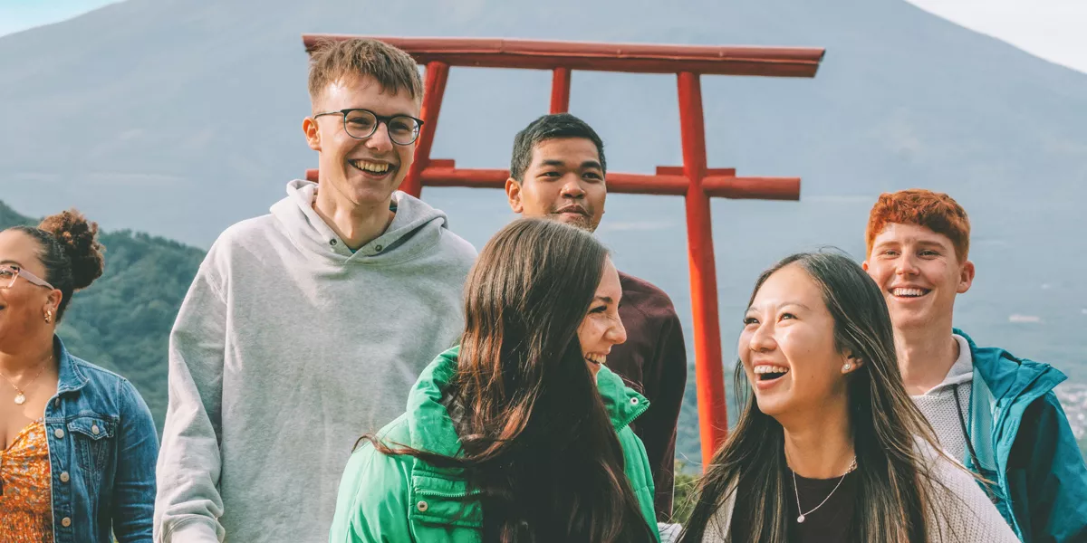 Group Laughing In Front Of Mount Fiji