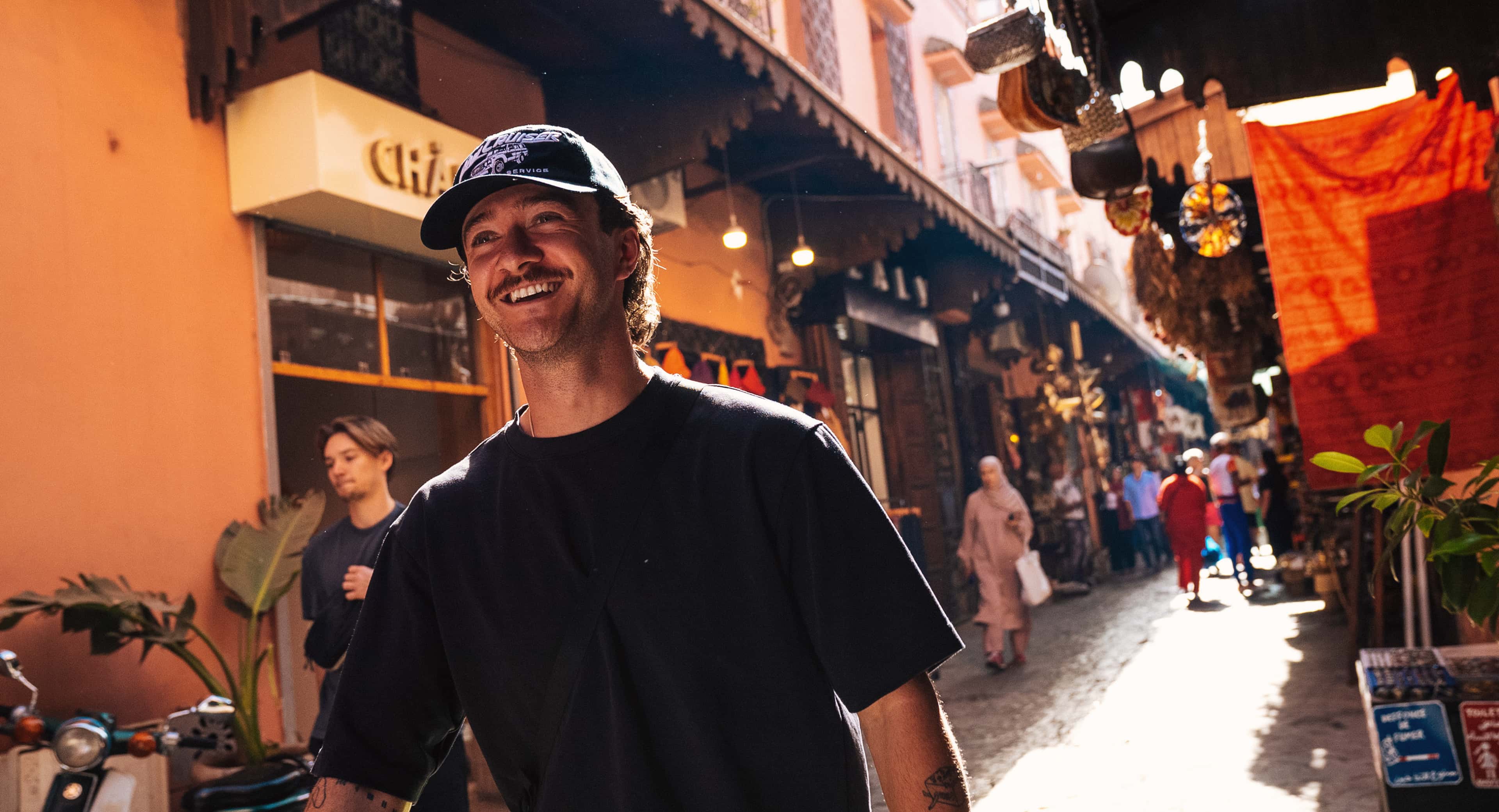 Nathanlust Banner Nathan Exploring Busy Street Marrakesh Morocco
