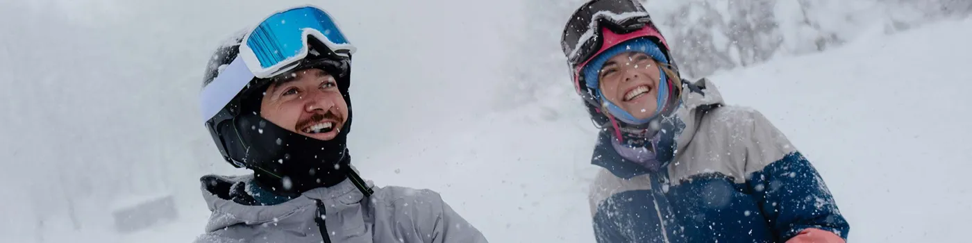 Woman And Man Laughing In Snow In Hakuba Japan
