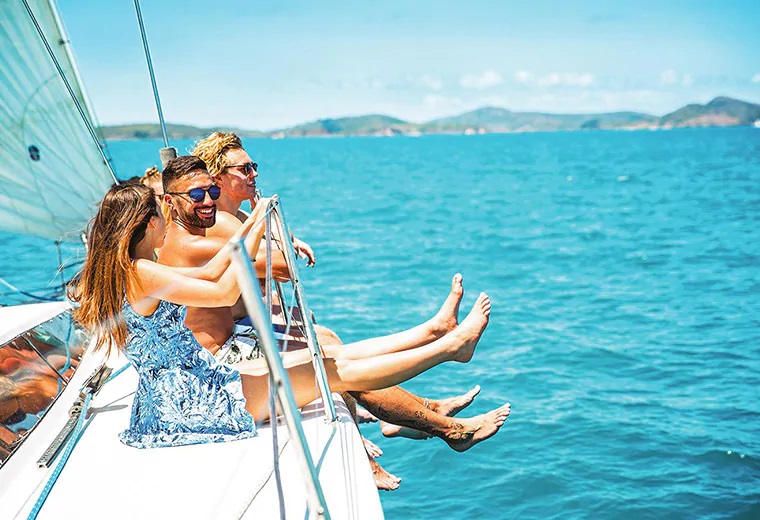 Travellers sailing around Whitsunday Islands, Australia