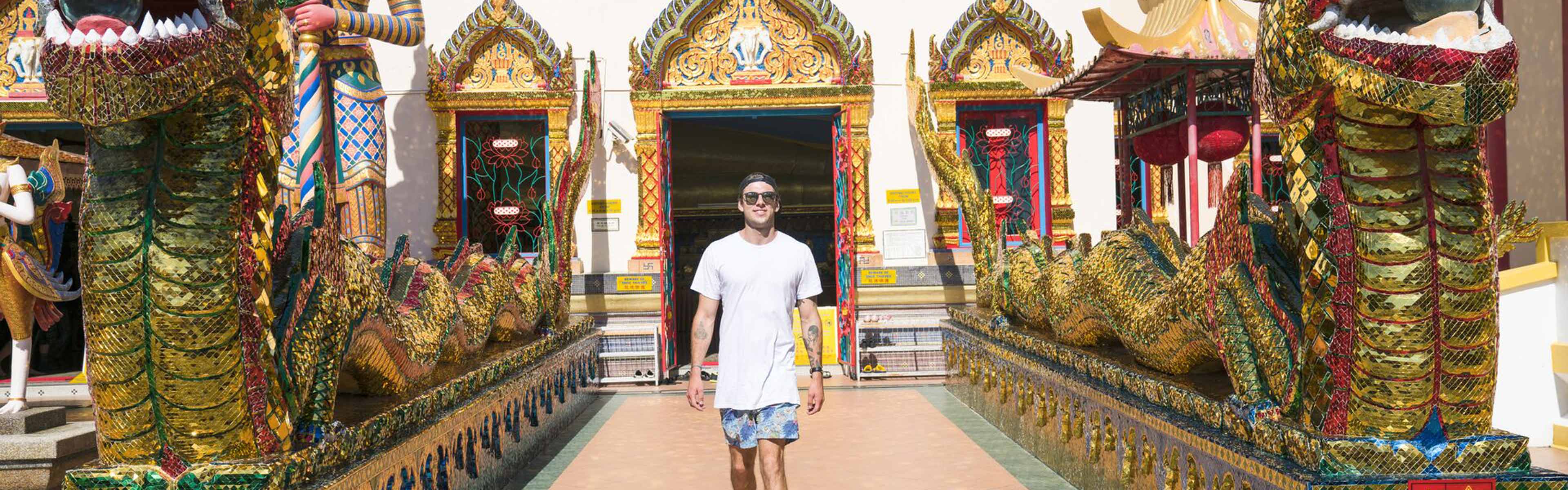 Traveller in front of Wat Chayamangkalaram shrine, Malaysia
