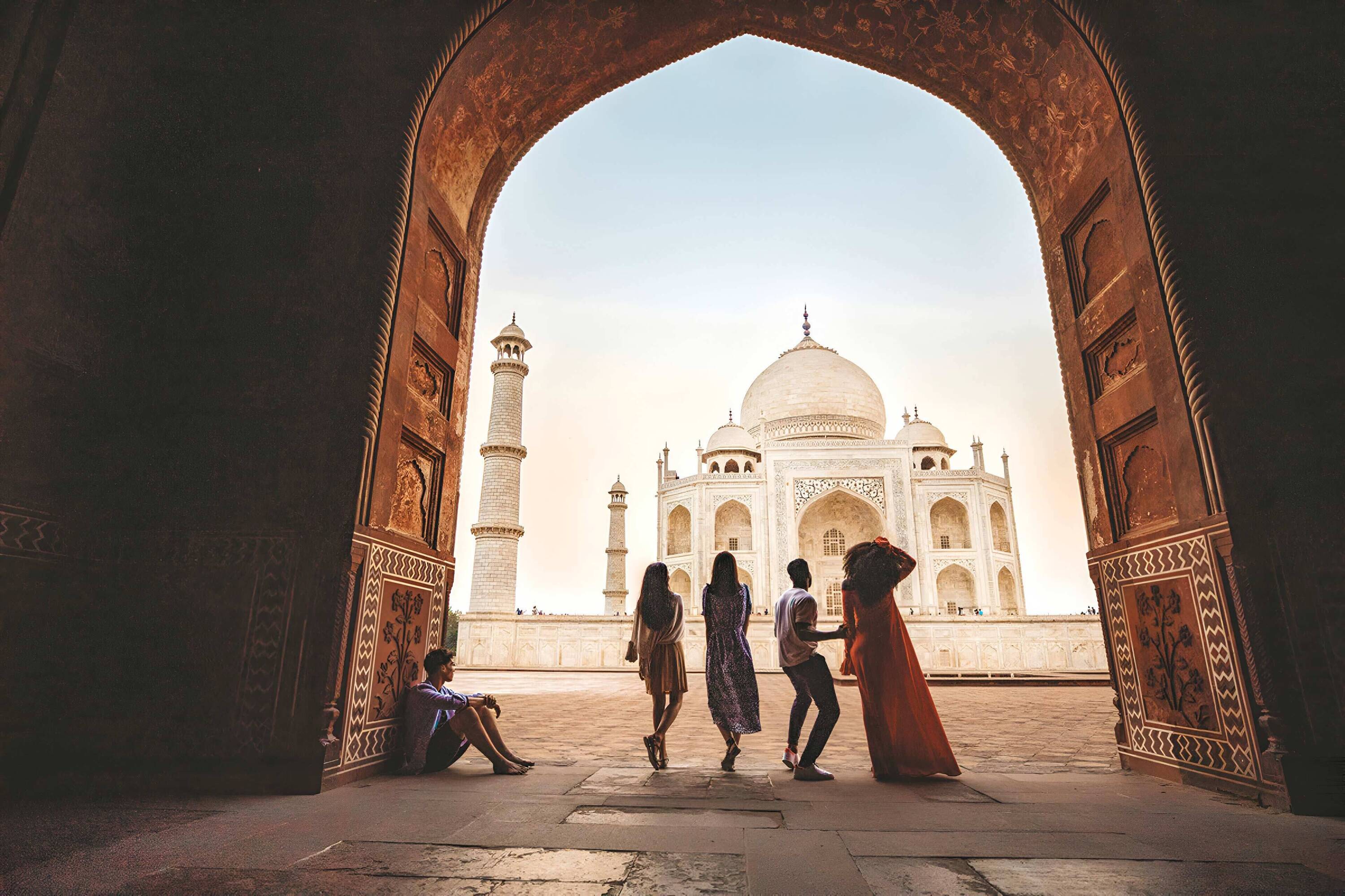 Group Of People Enjoying The View Of A Landmark in India
