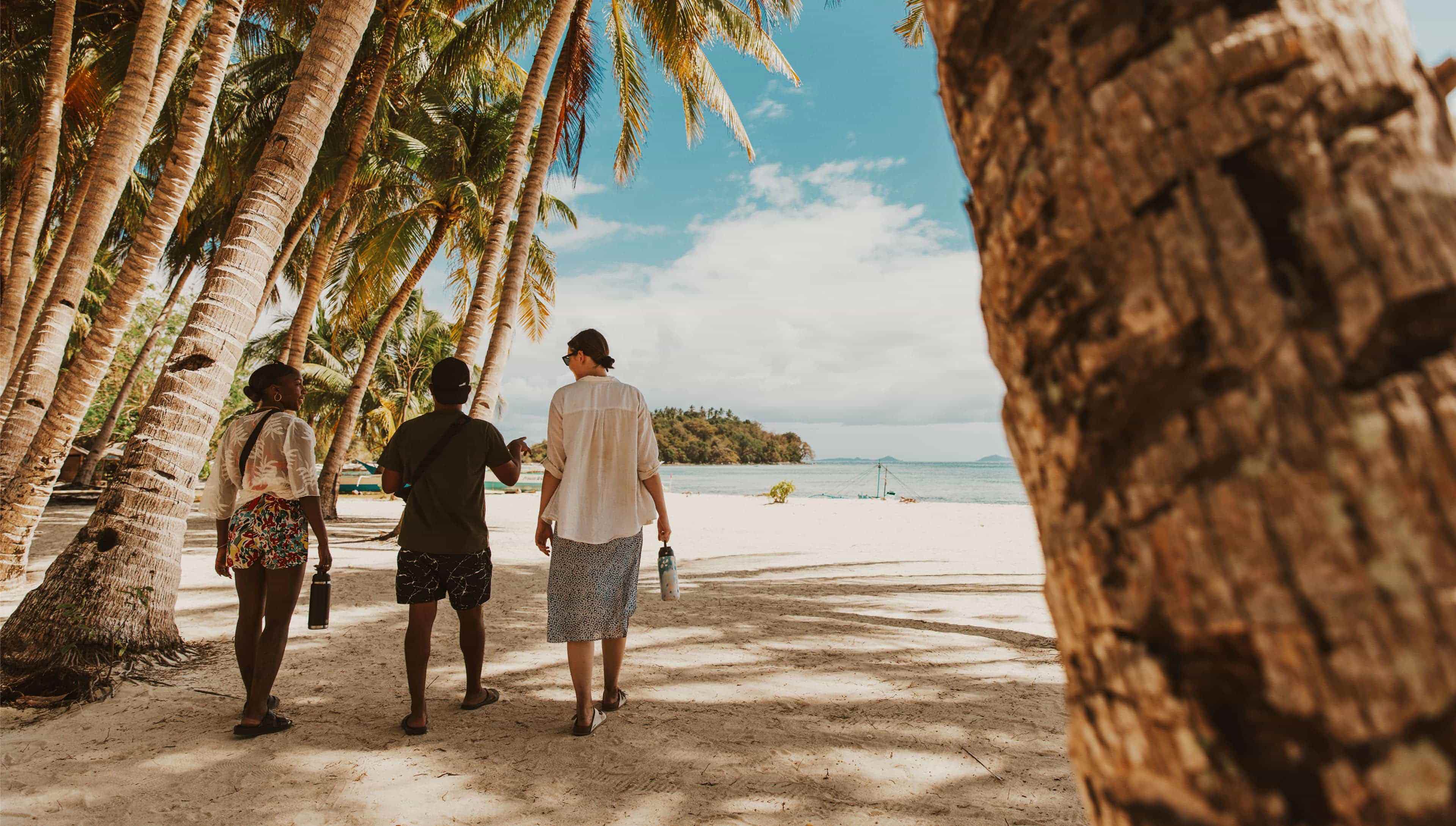 Travellers Strolling White Sand Beach Philippines