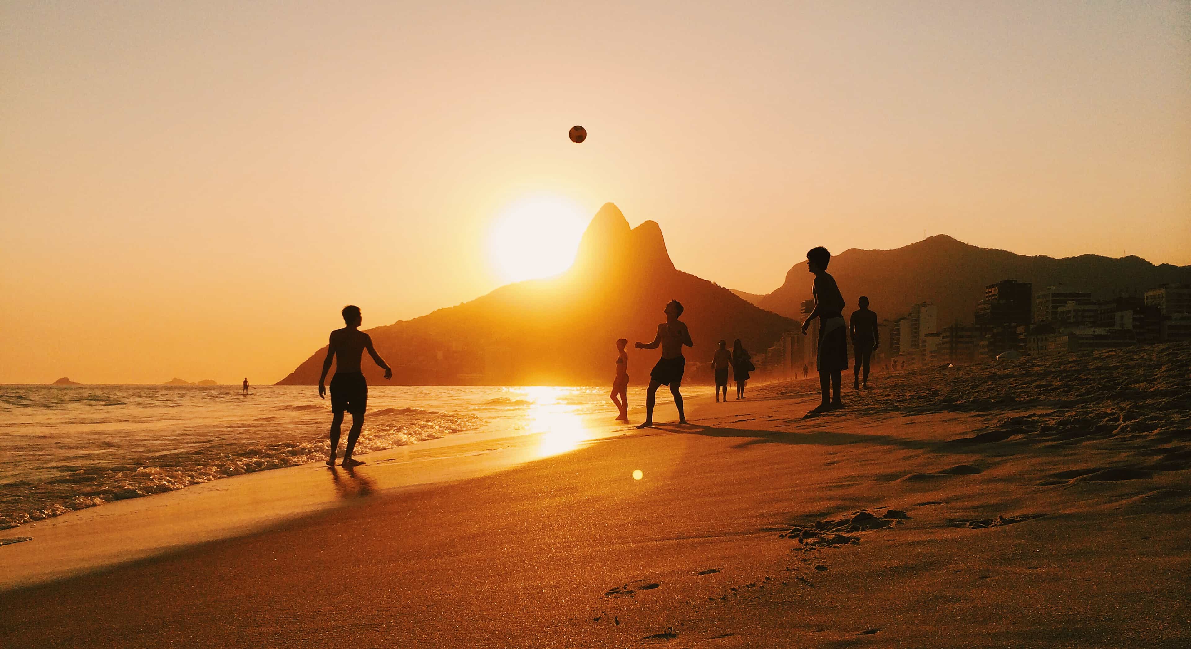 lmdlatam-banner-friends-kicking-football-beach-sunset-rio-brazil.jpg