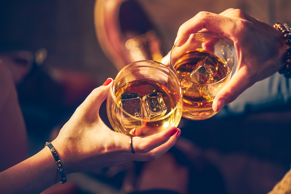 a-couple-makes-a-toast-with-two-glasses-of-whiskey.jpg