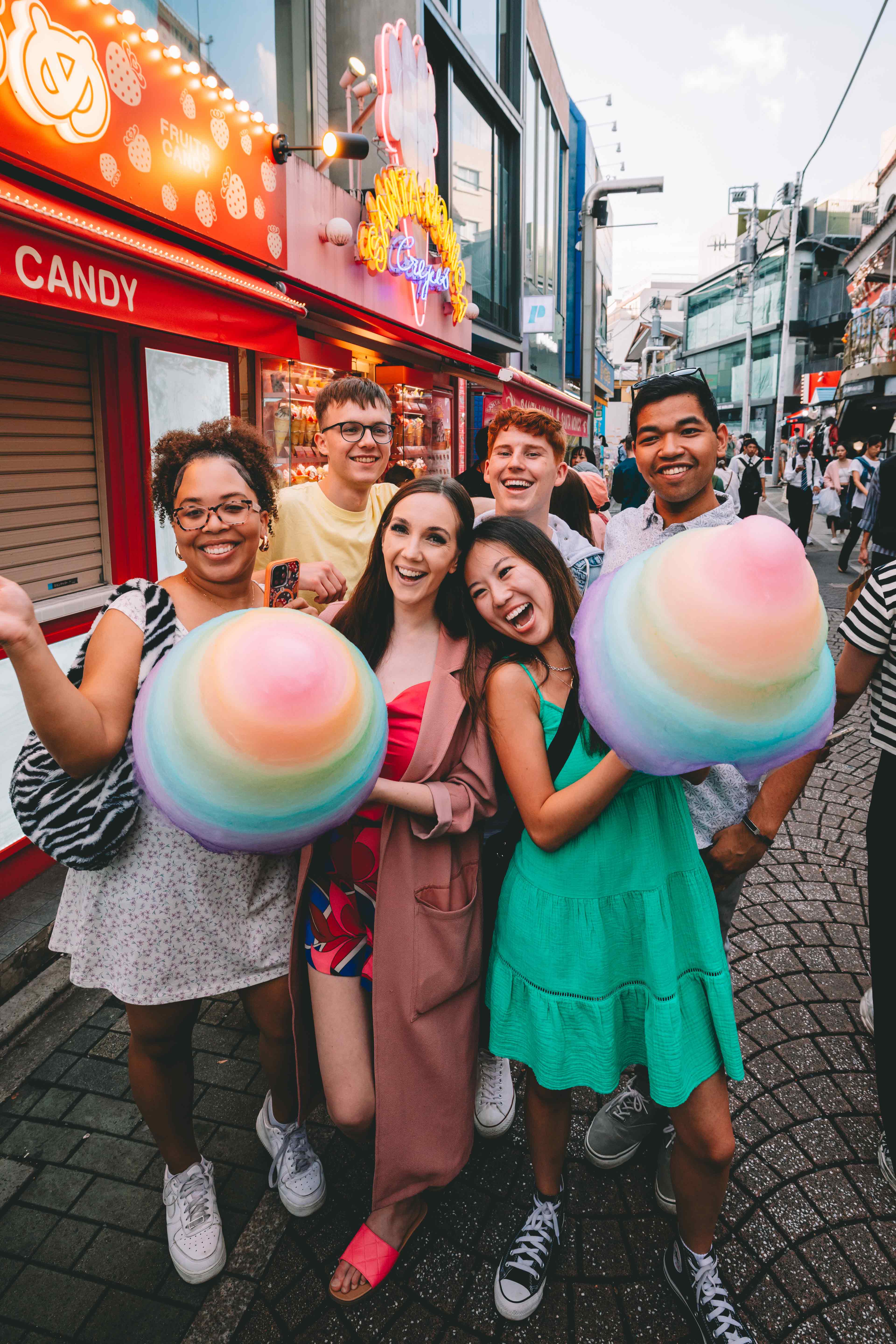 Group Of Young Travellers Having Fun On Harajuku Street Tokyo Japan