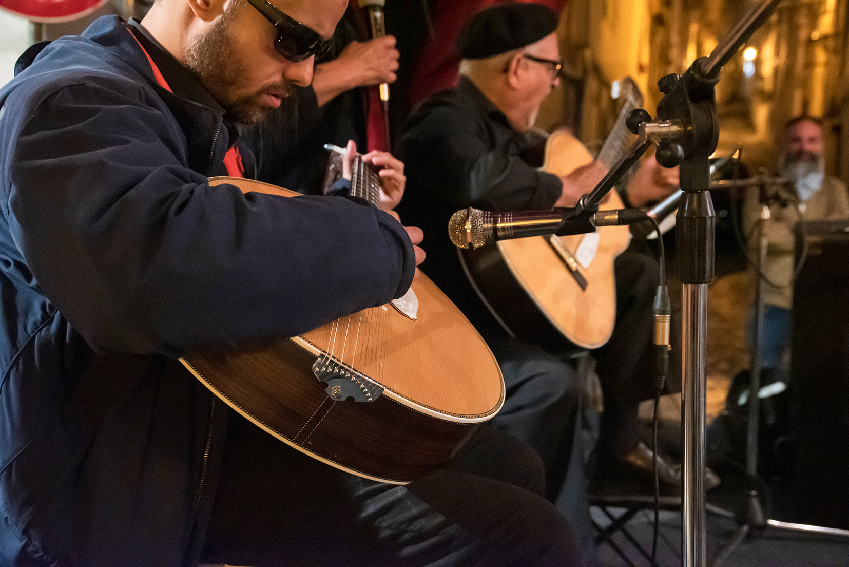 Musicians performing on stage at a Fado show, Porto, Portugal