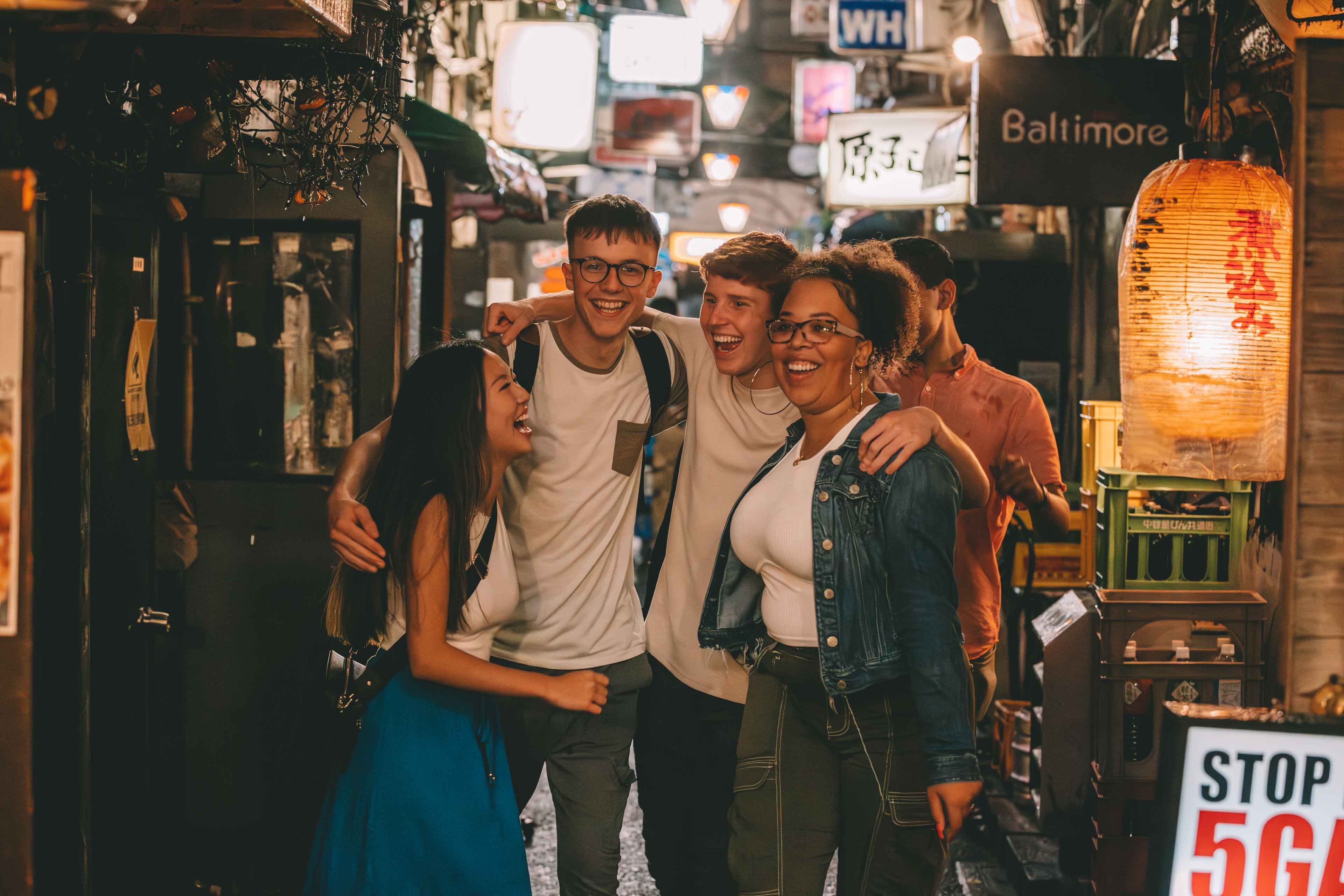 Group Of Young Travelers On A Contiki In Japan