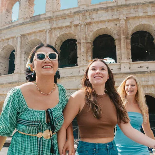 Travellers walking past the Colosseum in Rome, Italy - Contiki Rome, Athens & Cairo Tour
