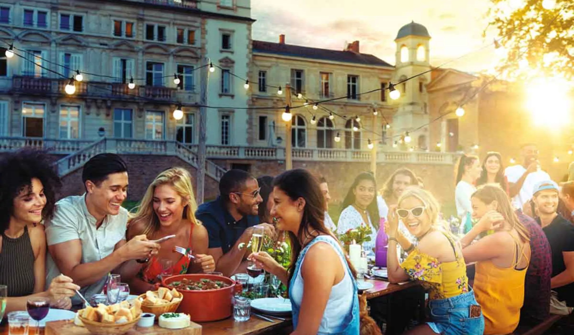 group-of-travelers-eating-al-fresco-at-chateau-in-france.jpg