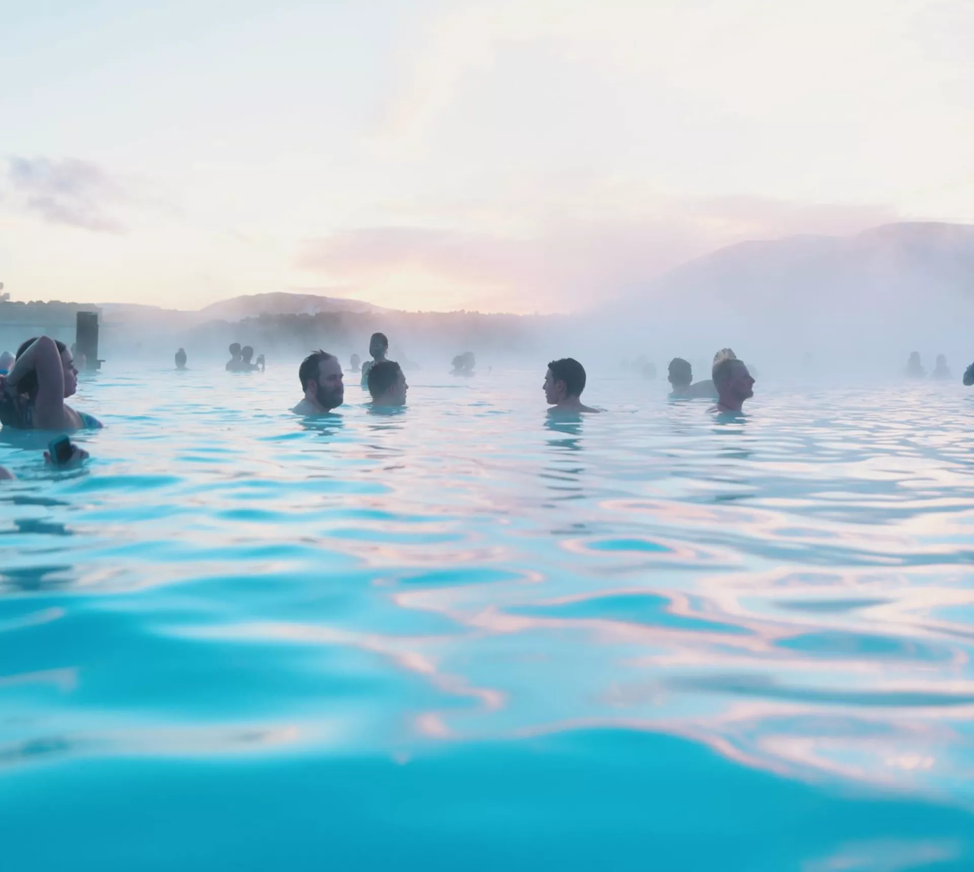 Contiki travellers bathing in the Blue Lagoon geothermal spa in Iceland - Contiki Best of Iceland Tour