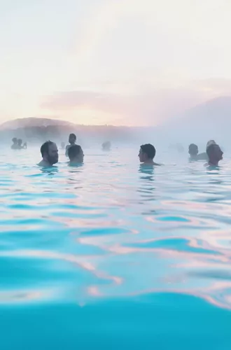 Contiki travellers bathing in the Blue Lagoon geothermal spa in Iceland - Contiki Best of Iceland Tour