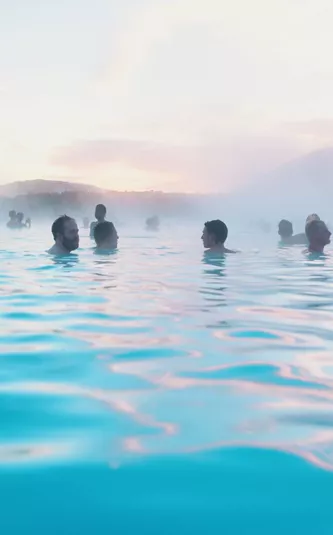 Contiki travellers bathing in the Blue Lagoon geothermal spa in Iceland - Contiki Best of Iceland Tour