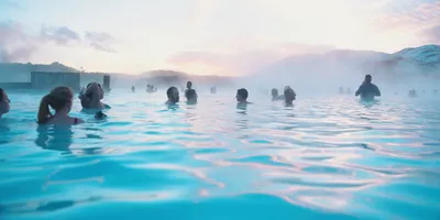 Contiki travellers bathing in the Blue Lagoon geothermal spa in Iceland - Contiki Best of Iceland Tour