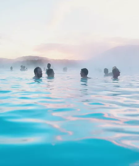 Contiki travellers bathing in the Blue Lagoon geothermal spa in Iceland - Contiki Best of Iceland Tour