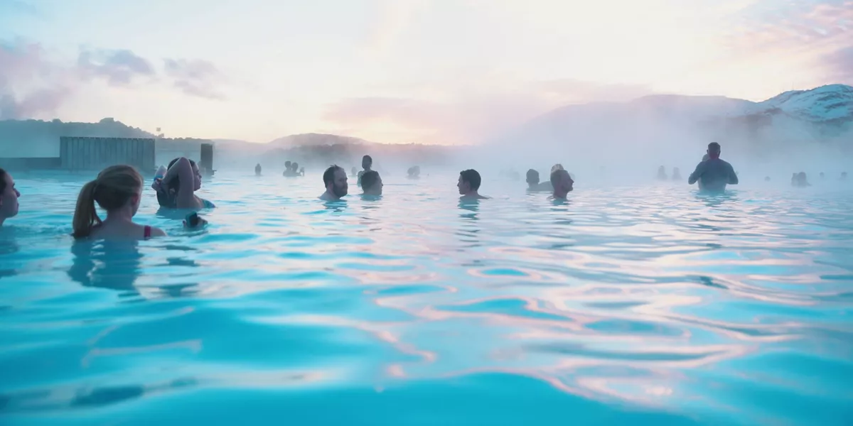 Contiki travellers bathing in the Blue Lagoon geothermal spa in Iceland - Contiki Best of Iceland Tour