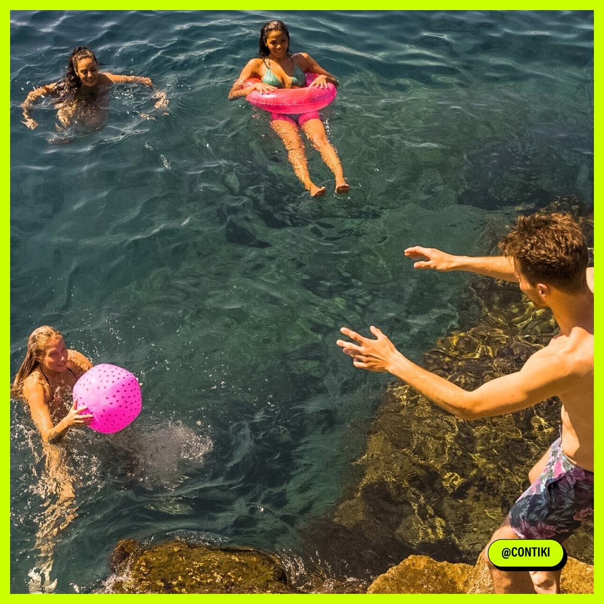 Travellers playing ball in the water, Croatia