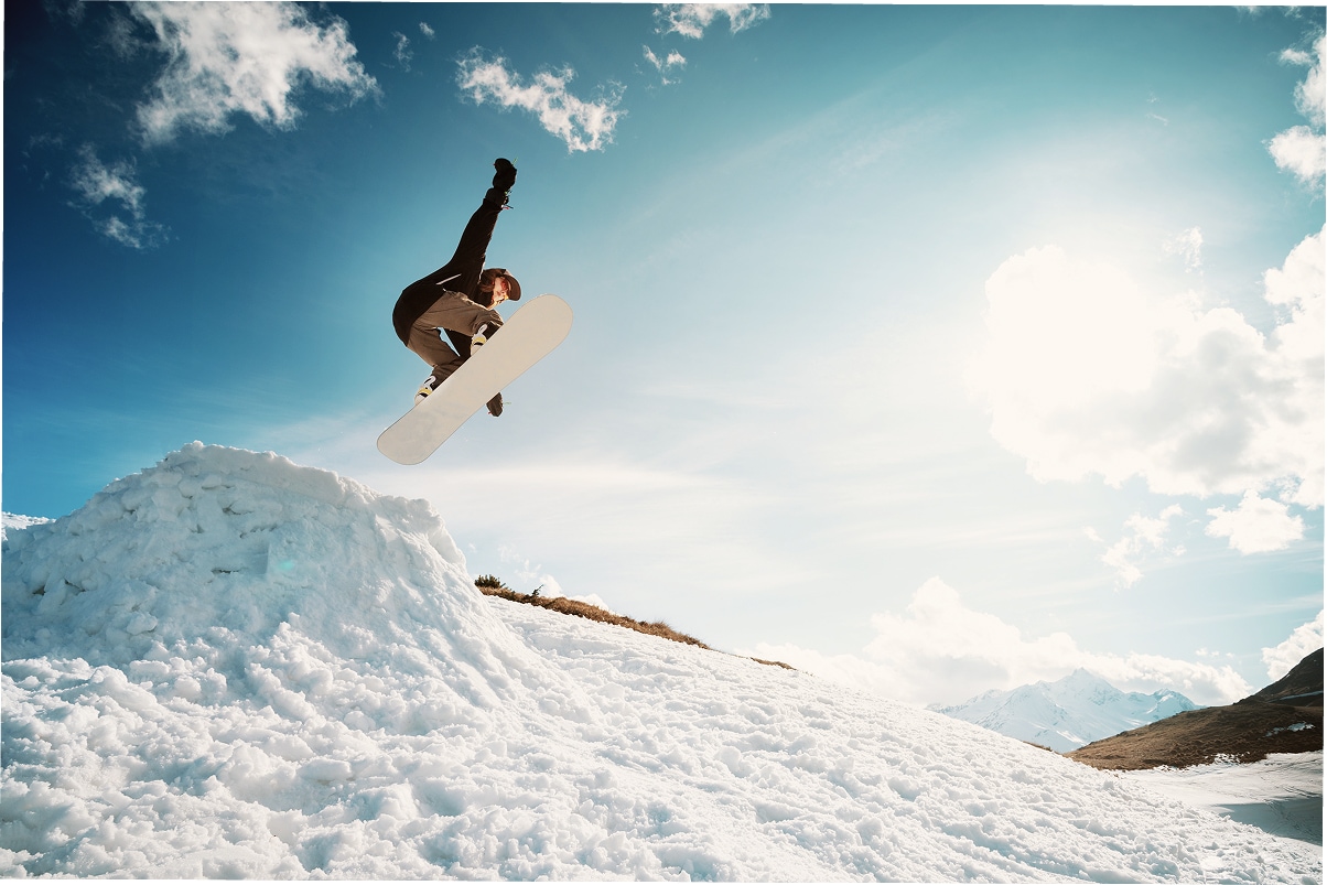 Snowboarder Jumps Ramp Trick