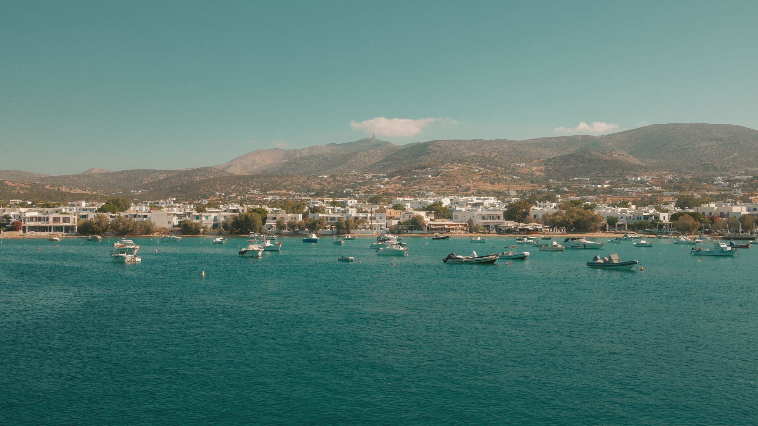 Boats anchored off the coast of Paros, Greece - Contiki's Best of Greece with Island Hopping Tour