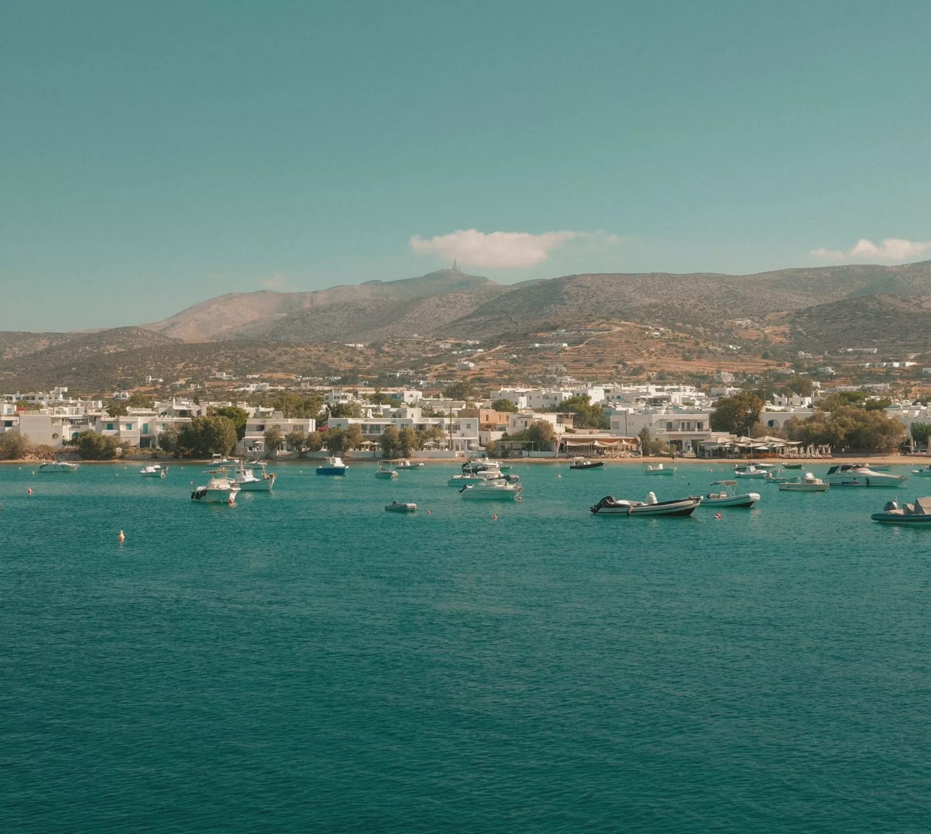 Boats anchored off the coast of Paros, Greece - Contiki's Best of Greece with Island Hopping Tour