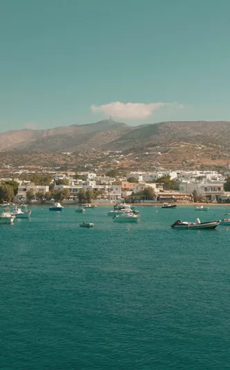 Boats anchored off the coast of Paros, Greece - Contiki's Best of Greece with Island Hopping Tour