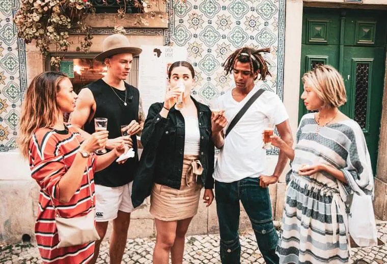 A Group of Pople Standing and Drinking Alcohol Together