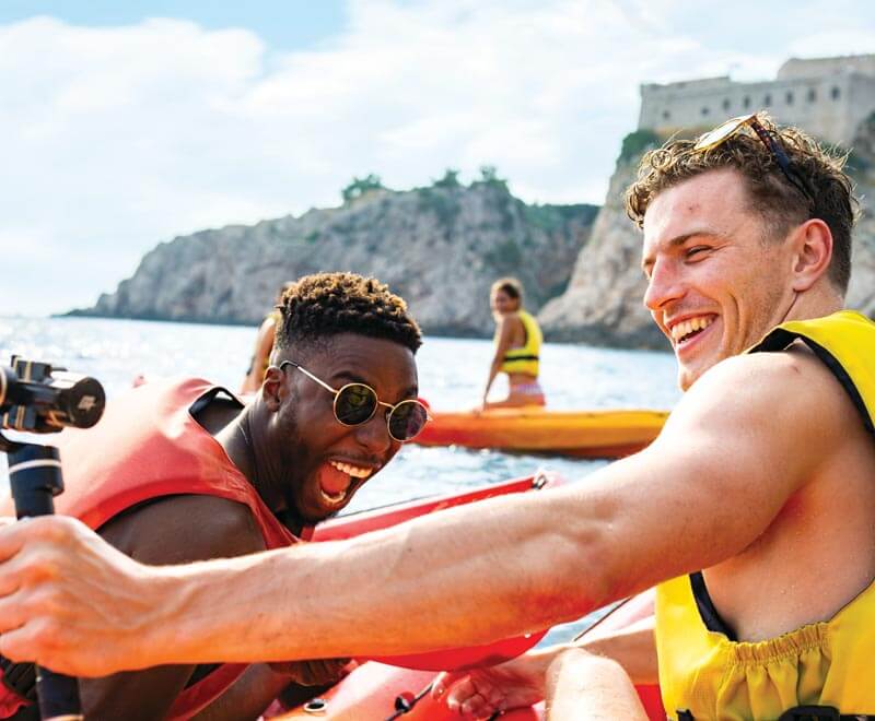 Men taking selfie in kayak