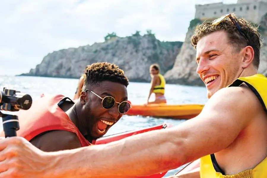 Men taking selfie in kayak