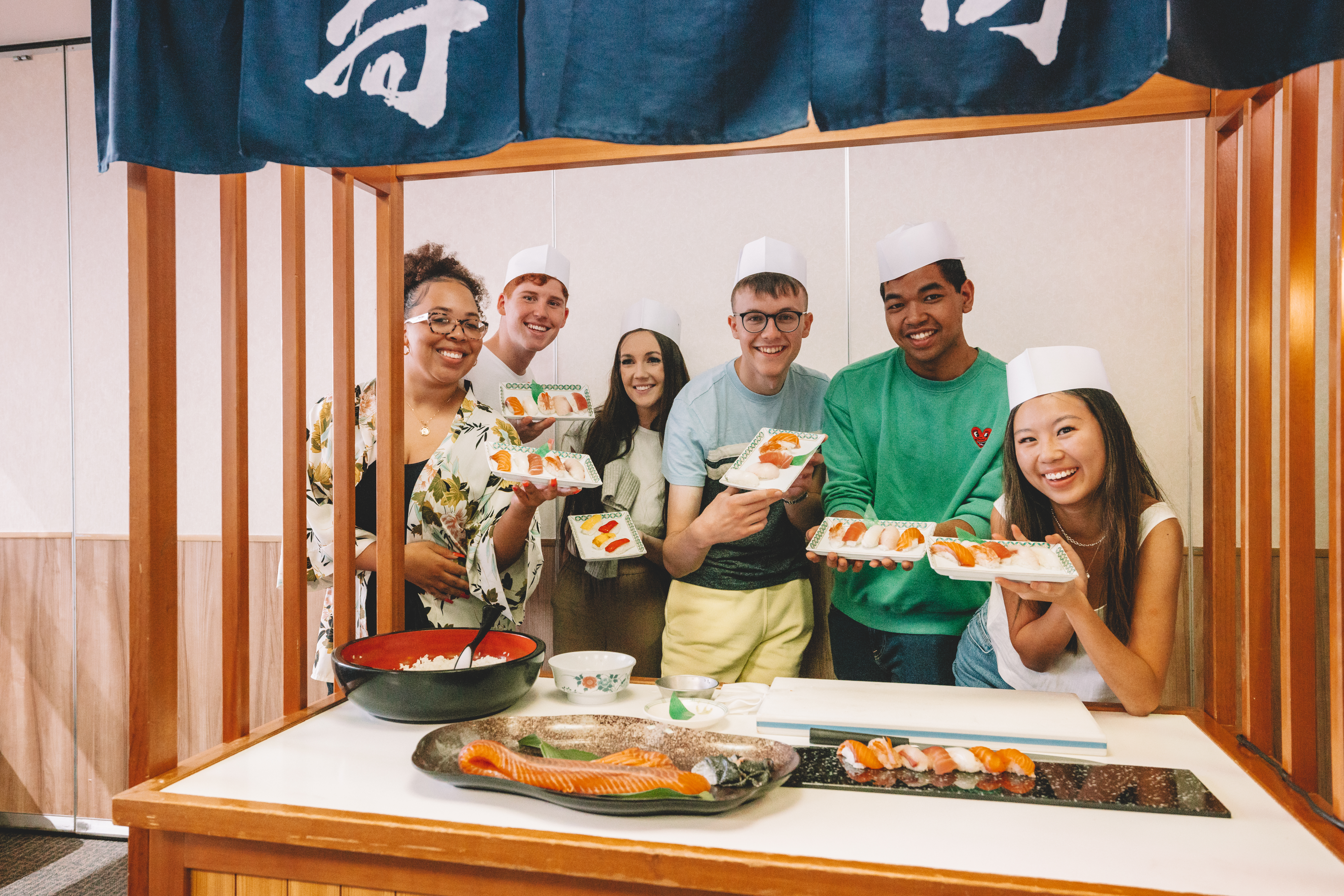 Young travellers making sushi
