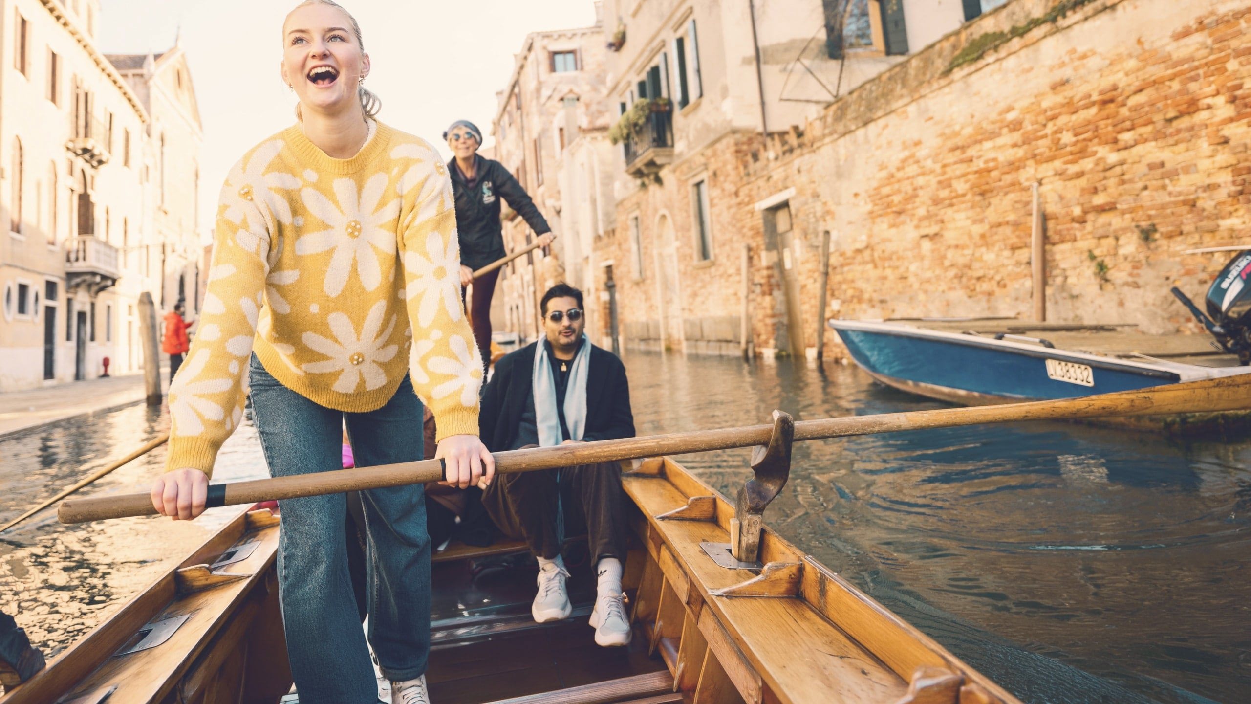 Contiki travellers glide through Venice's canals on a traditional gondola during the London to Rome Quest