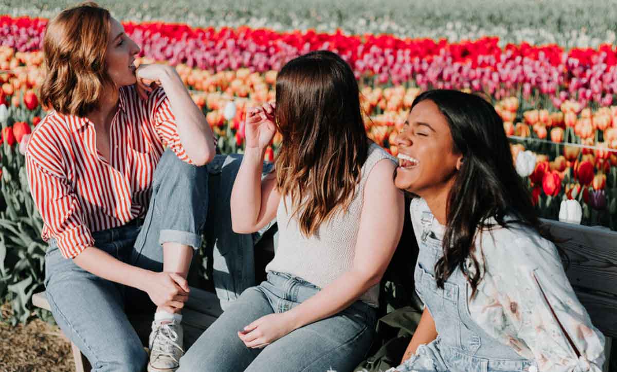 Three Young Travelers Enjoying The Tulip Fie;Ds Amsterdam