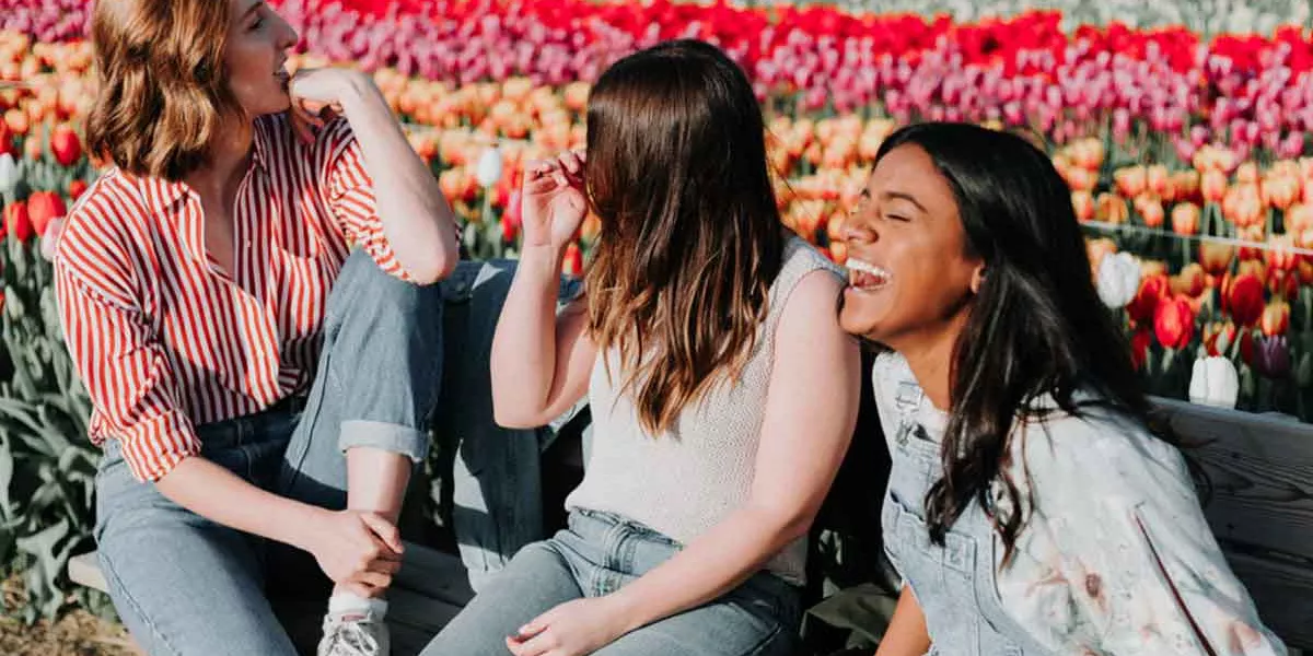 Three Young Travelers Enjoying The Tulip Fie;Ds Amsterdam