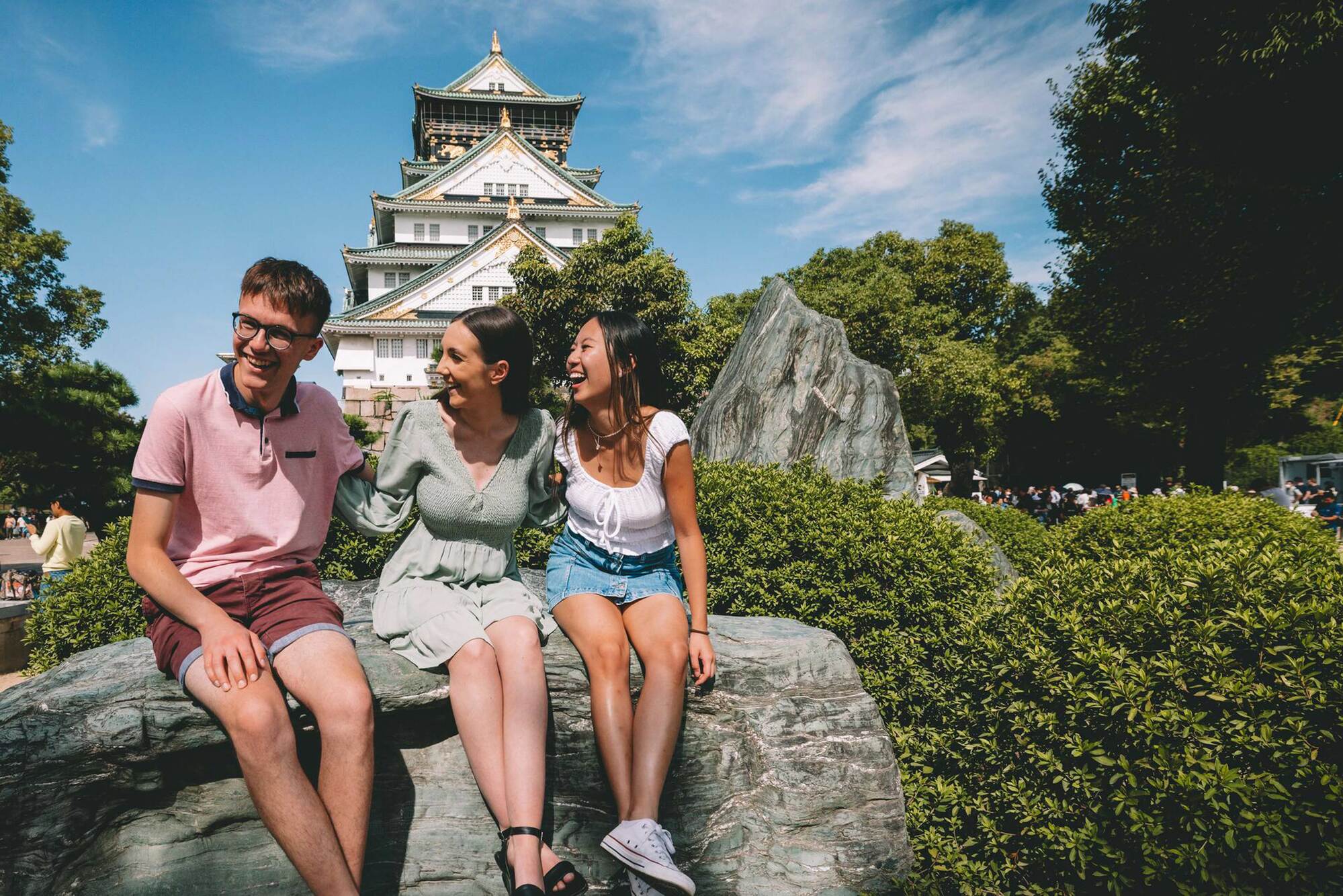 Friends Smiling Osaka Landmark As Background in Japan