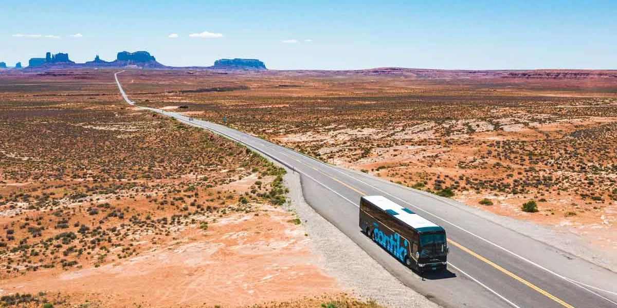 Coach Driving Through Desert In America