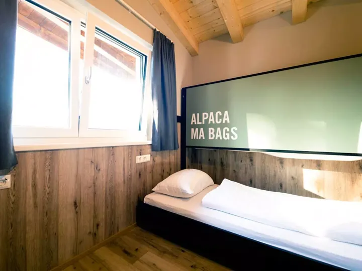Room with single bed at Gasthof Schoneck Hotel, Austria