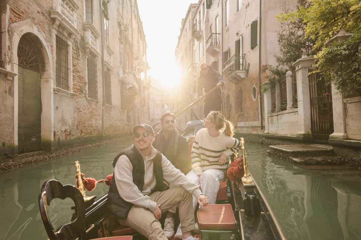 Travellers In Winter In Canals In Venice