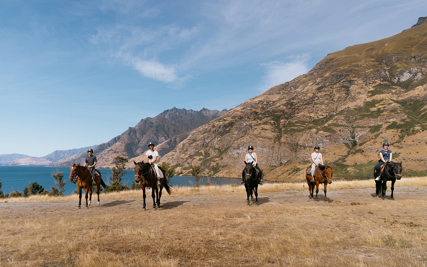 Travellers on horseback at Walter Peak High Country Farm, Queenstown, New Zealand