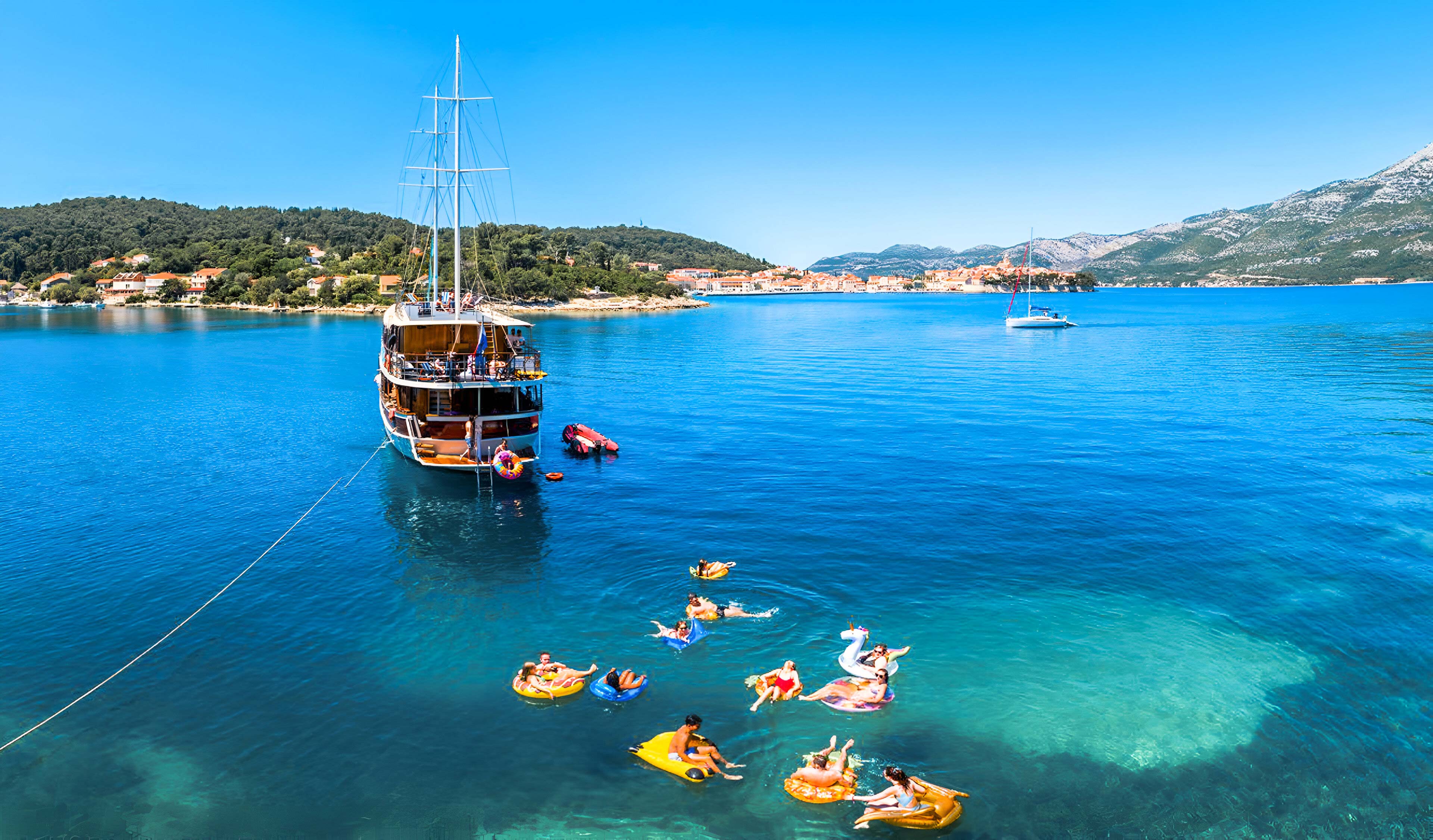 People Enjoying A Sailing Day
