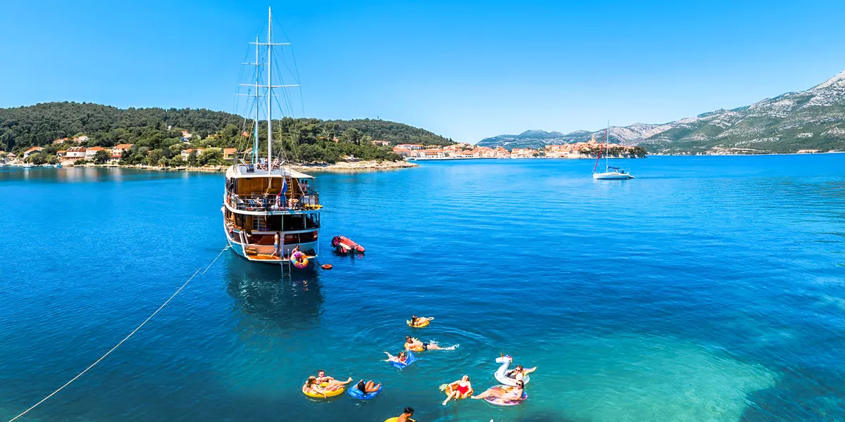 People Enjoying A Sailing Day