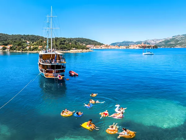 People Enjoying A Sailing Day