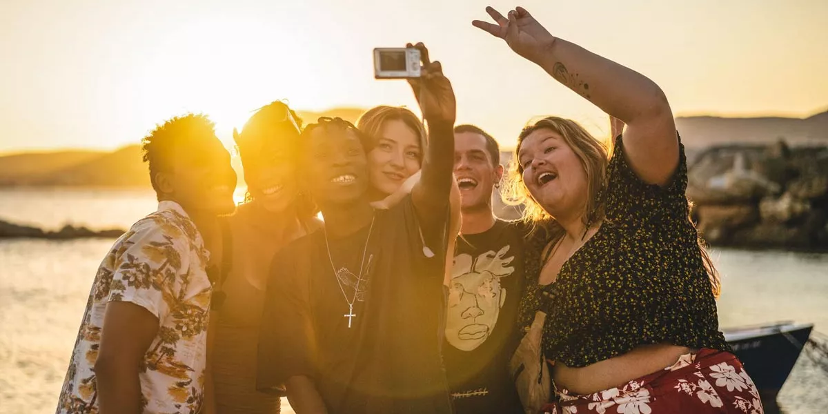 Friends Taking Picture Sunset Beach