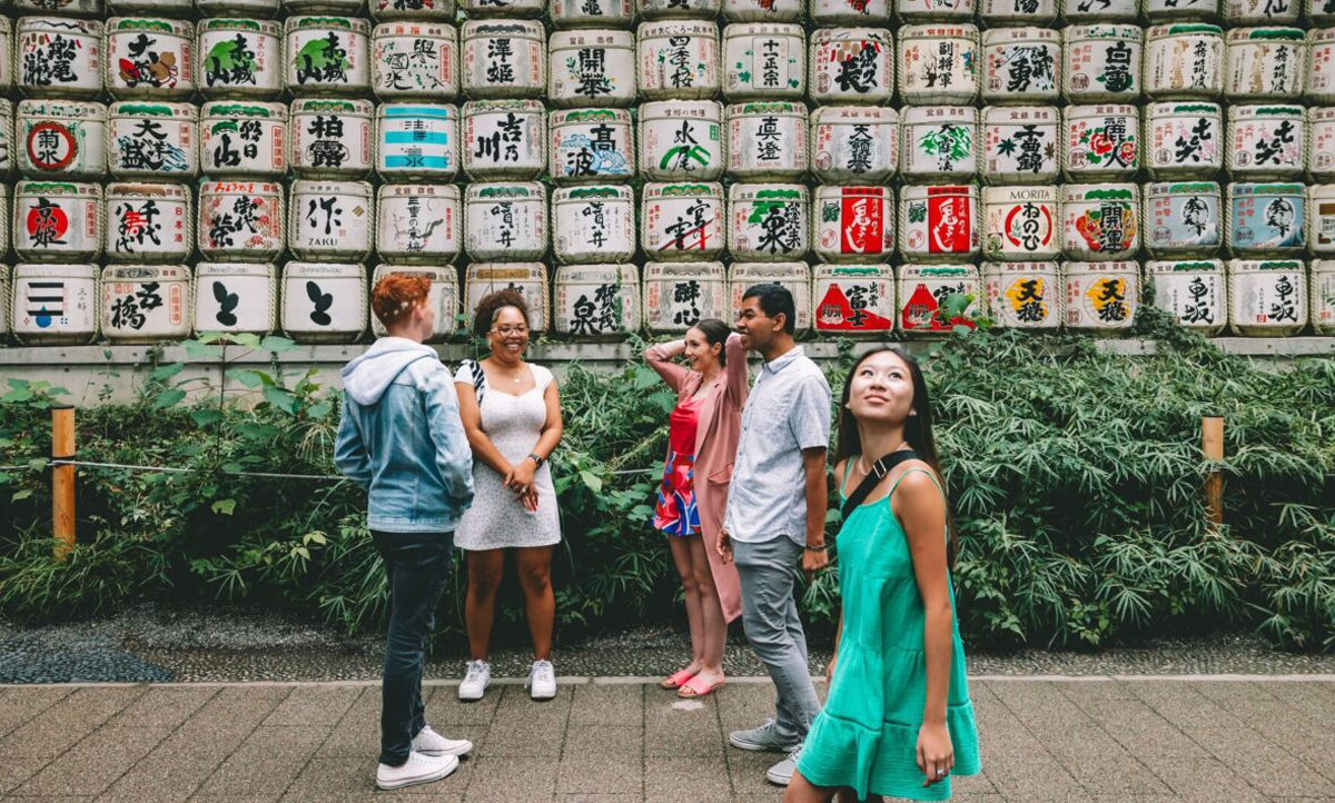 Group Exploring Street In Japan