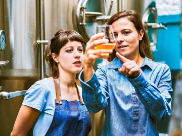 ottawa-brew-donkey-brewery-tour-hispanic-women-checking-quality-of-craft-beer-in-brewery-gettyimages-1184808099.jpg