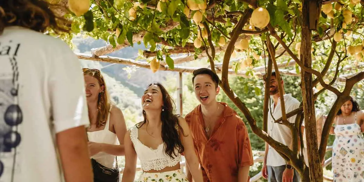 Travelers In A Lemon Field In Italy