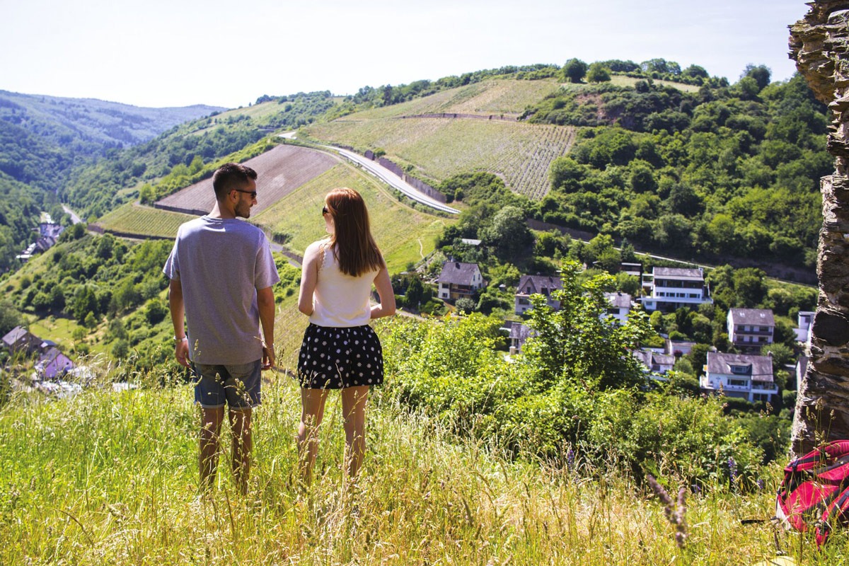 Two people looking at a valley nature around them  in Germany.
