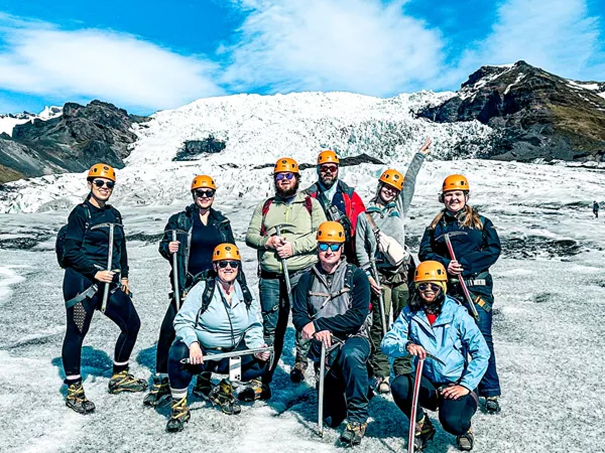 A group of friends hiking a glacier in Iceland.